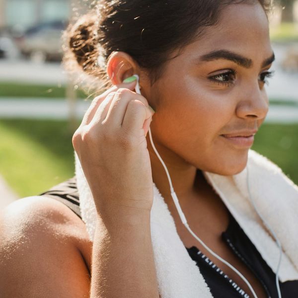 Smiling person feeling energetic and positive after a workout.